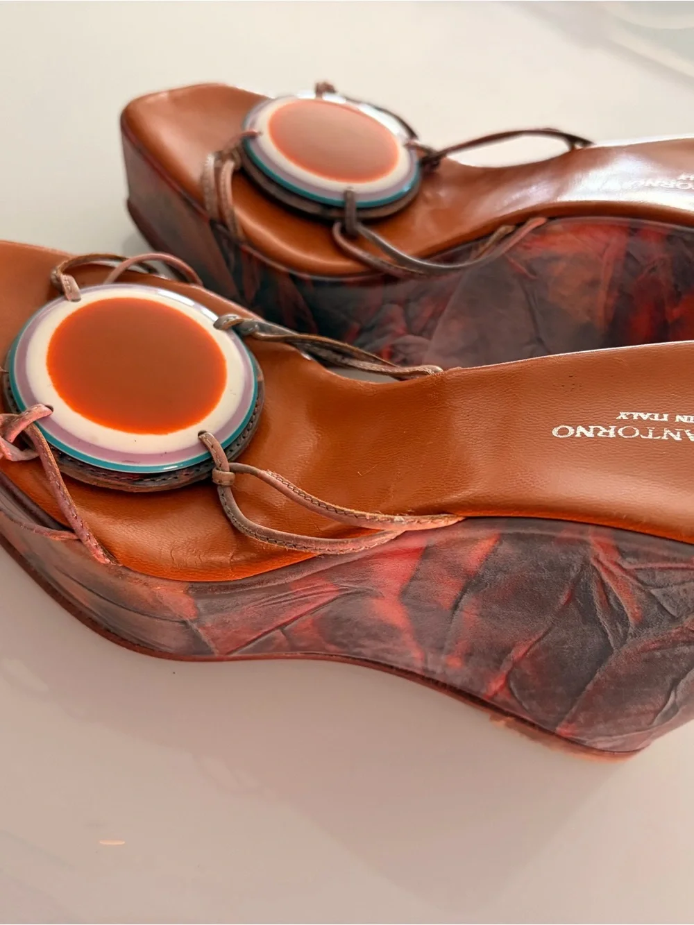 Orange Leather Wedge Slides with Decorative Medallion